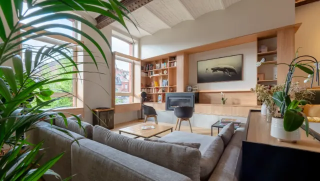 Salon d'un loft lillois rénové sous des voûtes en briques, photographie d'intérieur pour Atypik Intérieur